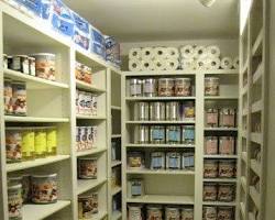 food pantry with shelves full of food and supplies.