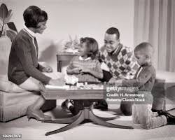 Image of family sitting at a table counting money together
