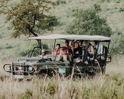 Image of jeep on a game drive in the Maasai Mara