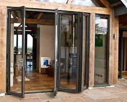 team of experienced installers installing aluminum bifold doors