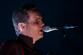 Jon Birgisson of Sigur Ros performs at the 1st Bank Center in Broomfield, Colo. Barely removing themselves from song, the Icelandic musicians spoke English ... - Sigur-Ros