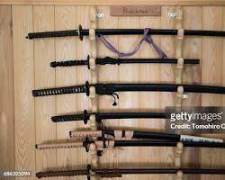 Image of traditional Japanese dojo with rows of swords on display