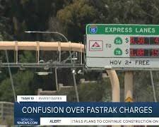 Image of confused driver looking at a FasTrak sign