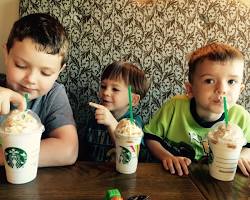 Image of children enjoying food and drinks at Starbucks