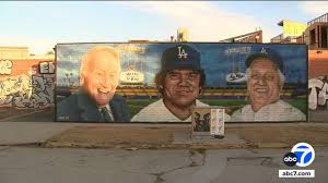 Mid-City mural honors Dodgers legend Fernando Valenzuela with Vin Scully 
and Tommy Lasorda