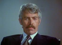 Der schwarze Panther - Panther-James_Coburn_als_Robert_Elliot