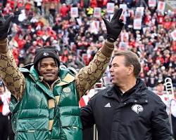 Image of Lamar Jackson celebrating touchdown at University of Louisville