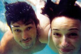 Burak Hakki swimming with his wife Sema Simsek Click for 585 x 393 image - 219038