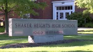 The exterior of Shaker Heights High School with a sign indicating closure for the day.