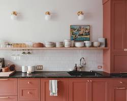 Image of happy couple admiring their newly renovated kitchen with marble countertops