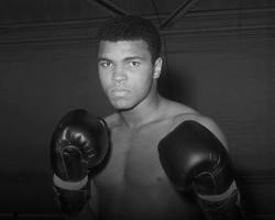 Image of Muhammad Ali five incredible career moments boxing highlights 1960 Olympic gold Sonny Liston 1964 Rumble in the Jungle 1974 Thrilla in Manila 1975 1996 Olympic cauldron lighting
