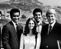 Mission Impossible 1966 TV series cast Peter Graves as Jim Phelps Martin Landau as Rollin Hand Barbara Bain as Cinnamon Carter Greg Morris as Barney Collier Peter Lupus as Willy Armitage 1960s CBS television stills tape recorder briefing tape smoke, AI generated