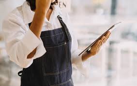 Premium Photo | Startup successful small business owner sme beauty girl stand with tablet smartphone in coffee shop restaurant Portrait of asian tan woman barista cafe owner SME entrepreneur seller business concept