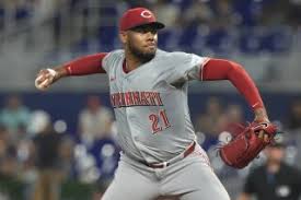 Colin Rea pitching during a game, showcasing his unique skills