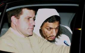 Richard Reid, right, with an FBI agent is transported in a car from State Police barracks at Logan International Airport in 2001 Photo: AP - Richard-Reid_1421121c