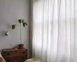 Image of living room with white curtains