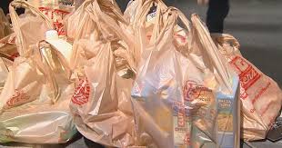 California Gov. Gavin Newsom signs law banning plastic shopping bags at grocery stores