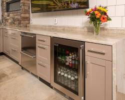 Image of outdoor kitchen with a refrigerator