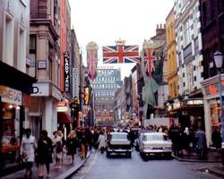 Image of Carnaby Street in 1969, showing a sign that says Welcome to Carnaby Street