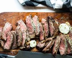 Image of New York strip steak chilling on a cutting board
