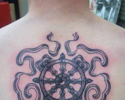 Image of Buddhist Dharma Wheel Tattoo