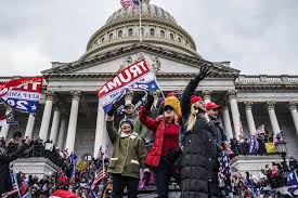 DOJ Places Prosecutors on Leave After Jan. 6 'Rioters' Description