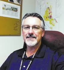 Newly-hired Nye County Planning Director Bobby Lewis sat in his office this week, with a Pahrump Regional Planning ... - web1_PVT-Lewis6264-102513