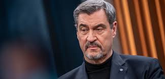 Söder kritisiert AfD und Merz für Umgang mit Migration