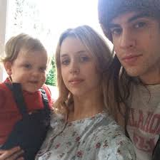 In one Geldof-Cohen family snap, Peaches stands beside hubby Thomas while holding Astala. In another, captioned, &quot;Me and my big man&quot;, Peaches holds Astala ... - peaches3--a