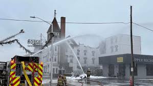 Fire erupts at historic Escanaba hotel, causing roof to collapse; no injuries reported