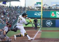 A’s, Red Sox split first two games