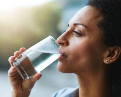 Image of Person drinking water