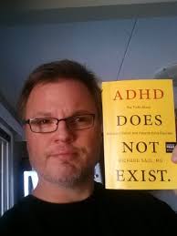 Adult ADHD Blog Creator Jeff Emmerson holding Dr. Richard Saul&#39;s Book ADHD Does Not Exist. After a team of mental health specialists gave me my adult ADHD ... - Adult-ADHD-Blog-Creator-Jeff-Emmerson-holding-Dr.-Richard-Sauls-Book-ADHD-Doesnt-Exist