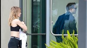 Suki Waterhouse showcases her jaw-dropping figure in tiny shorts and crop top as she steps out with fiancé Robert Pattinson
