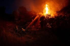 Thousands under evacuation orders in southern California as wildfire threatens homes