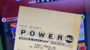 Powerball drawing October 21 2026 ticket and live studio broadcast on a TV screen