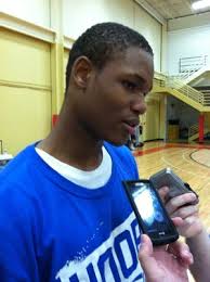 Hoffman Estates, Ill. — Sitting in a dark meeting room in the basement of Sears Centre, with his mom, Sonya, to his left and AAU coach, Darius Cobb, ... - mclemore_t300