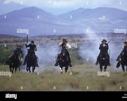 Image of group of cowboys on horseback, riding through the rugged Arizona desert, representing the Earp Vendetta Ride