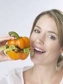 Stock Photography of Woman with an orange pepper burger u10839220 - Search ... - u10839220