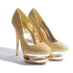 Gold high heeled shoes