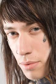 Trace Cyrus of the band Metro Station shows his tattoo during a photo. - 90128391-trace-cyrus-of-the-band-metro-station-shows-gettyimages