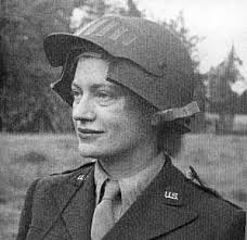 (c) Lee Miller Archive, All rights reserved. Miller wears a special helmet to accommodate her camera as a war correspondent in World War II. - leemill3