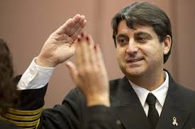 Larry Rooney raises his right hand as he is sworn in as the new Lodi fire chief by City Clerk Randi Johl during a ceremony on Thursday, Jan. 5, 2012. - 4f0708ed8dd23.image