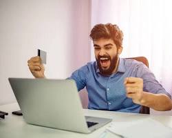 person celebrating a successful online purchase resmi