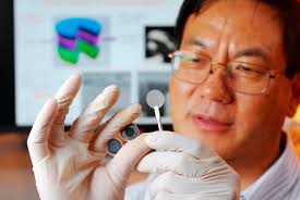 Self charging power cell. Georgia Tech researcher Zhong Lin Wang holds the components of a new self-charging power cell that uses piezoelectric materials to ... - self-charging60