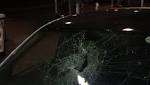 Driver unhurt after brick smashes