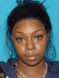 Amber Higgins, 23, of Newark, faces charges including conspiracy, unlawful possession of a weapon, defacing firearms and resisting arrest. - Amber-Higgins