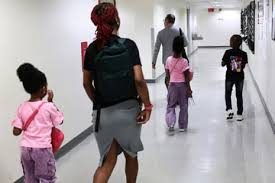 Families arriving for an immigration court hearing in New York City
