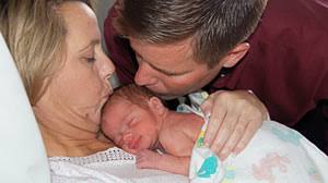 PHOTO: Shown here is Carolyn and Sean Savage with their baby. - ht_savage_baby_jp_110224_wmain