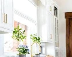 Image of kitchen with bright blue upper cabinets and white lower cabinets